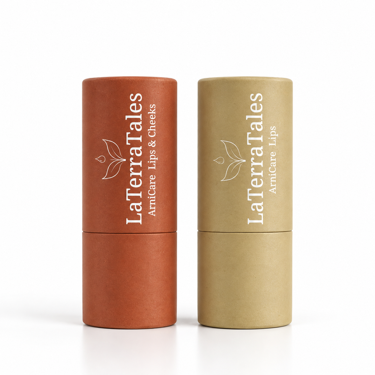 Two LaTerraTales ArnicaCare lip balm tubes standing upright on a white background, one in terracotta orange and one in light tan 