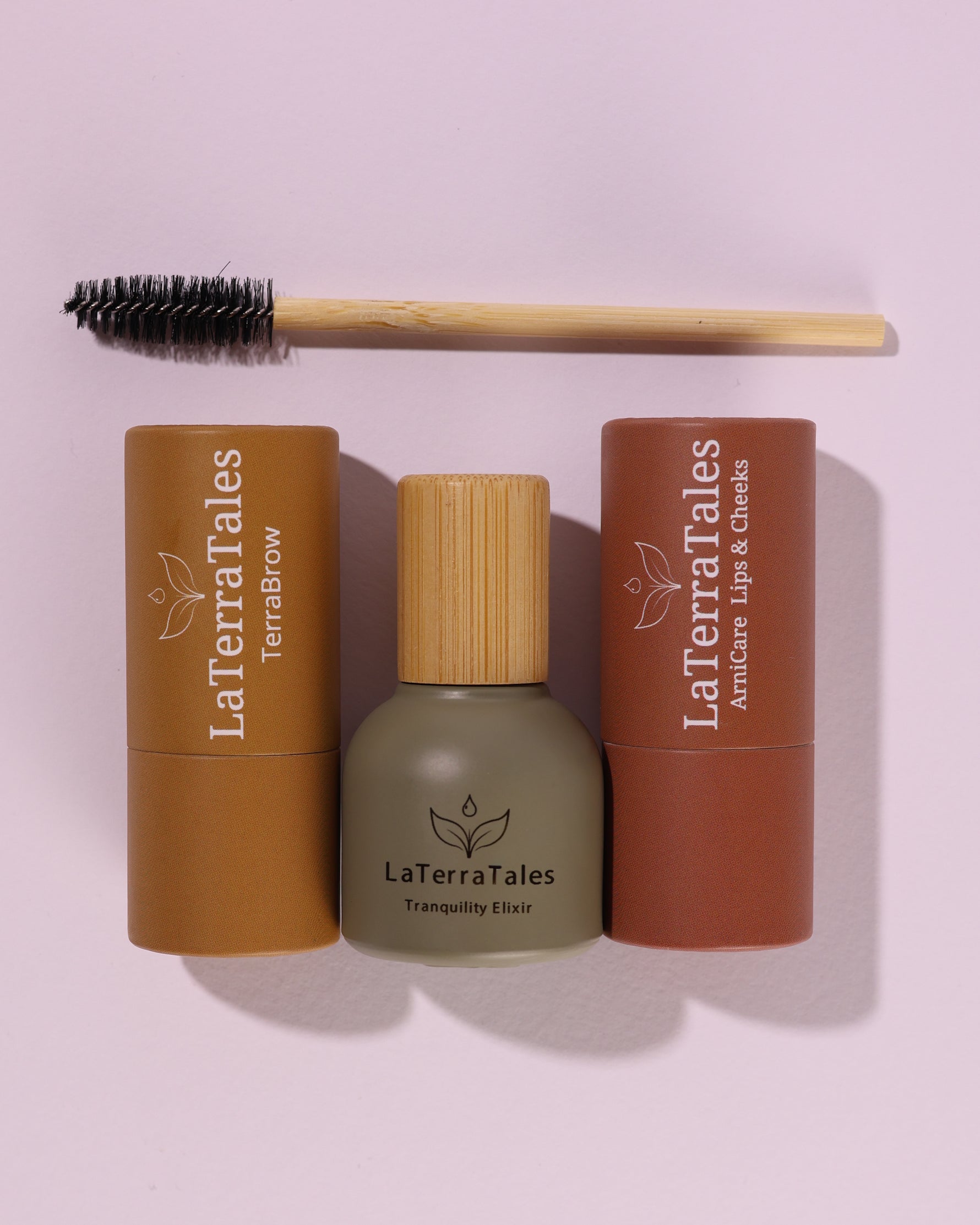 Three cosmetic products of LaTerraTales eyebrow growth ArniCare lips and cheeks healing balm and blush and Tranquility Elixir roll stress-relief